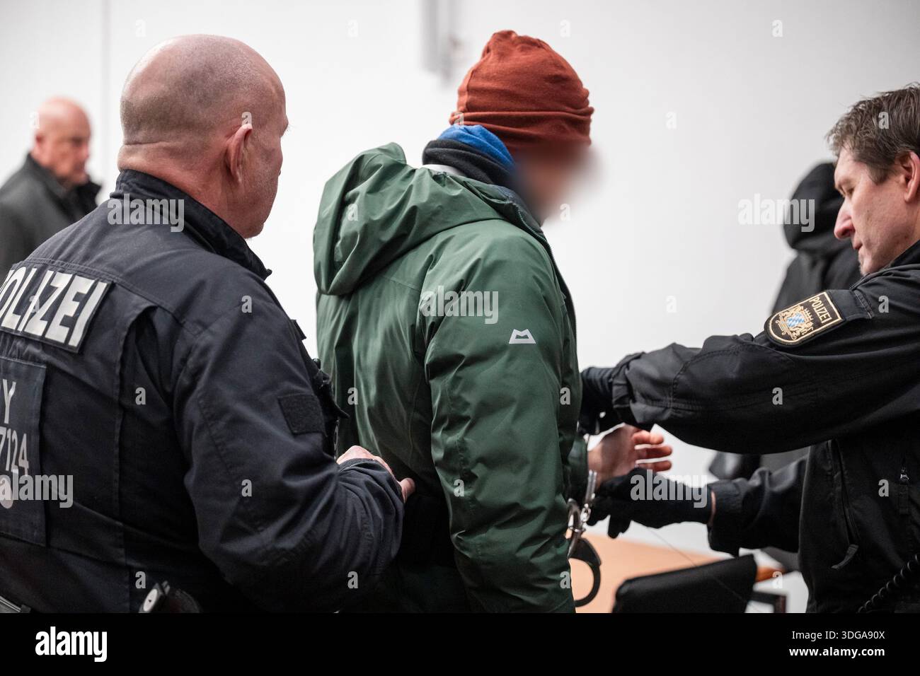 Hof, Germany. 16th Jan, 2026. The handcuffs are removed from one of the ...