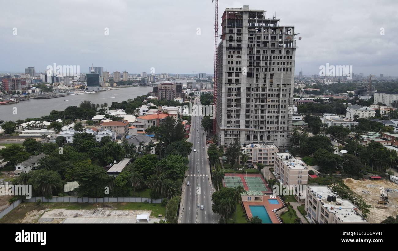 Aerial view of modern buildings contrasting with lush greenery along the roadsides, Lagos, Lagos State, Nigeria. Stock Photo