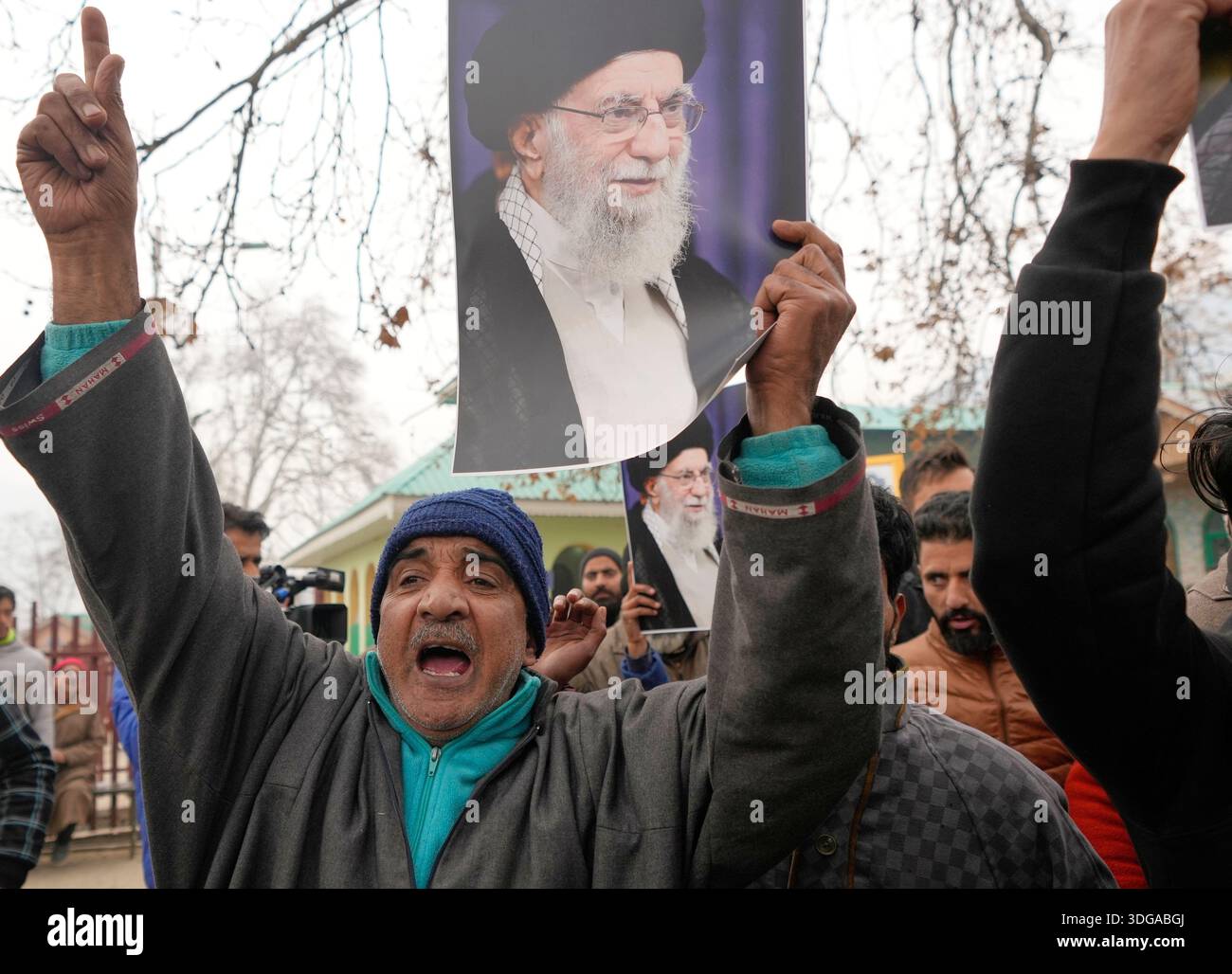 Kashmiri Shiite Muslim protesters chant slogans and hold photographs of ...
