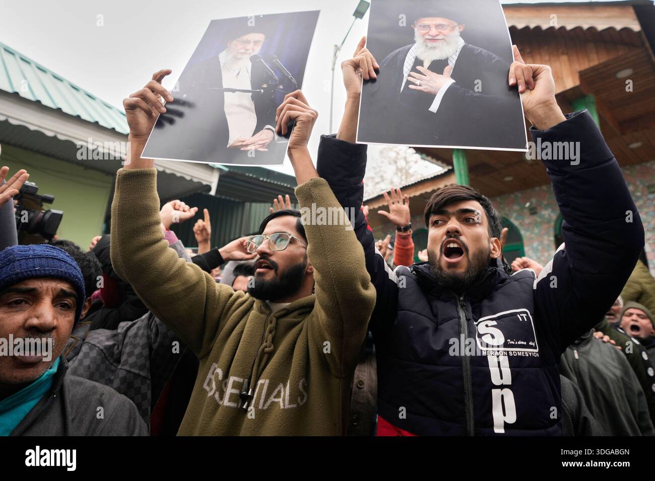 Kashmiri Shiite Muslim protesters chant slogans and hold photographs of ...
