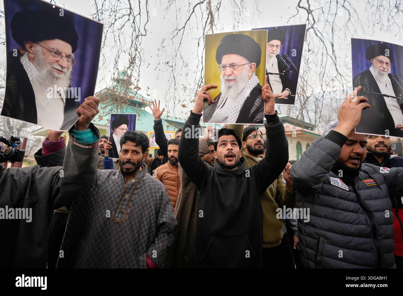 Kashmiri Shiite Muslim protesters chant slogans and hold photographs of ...