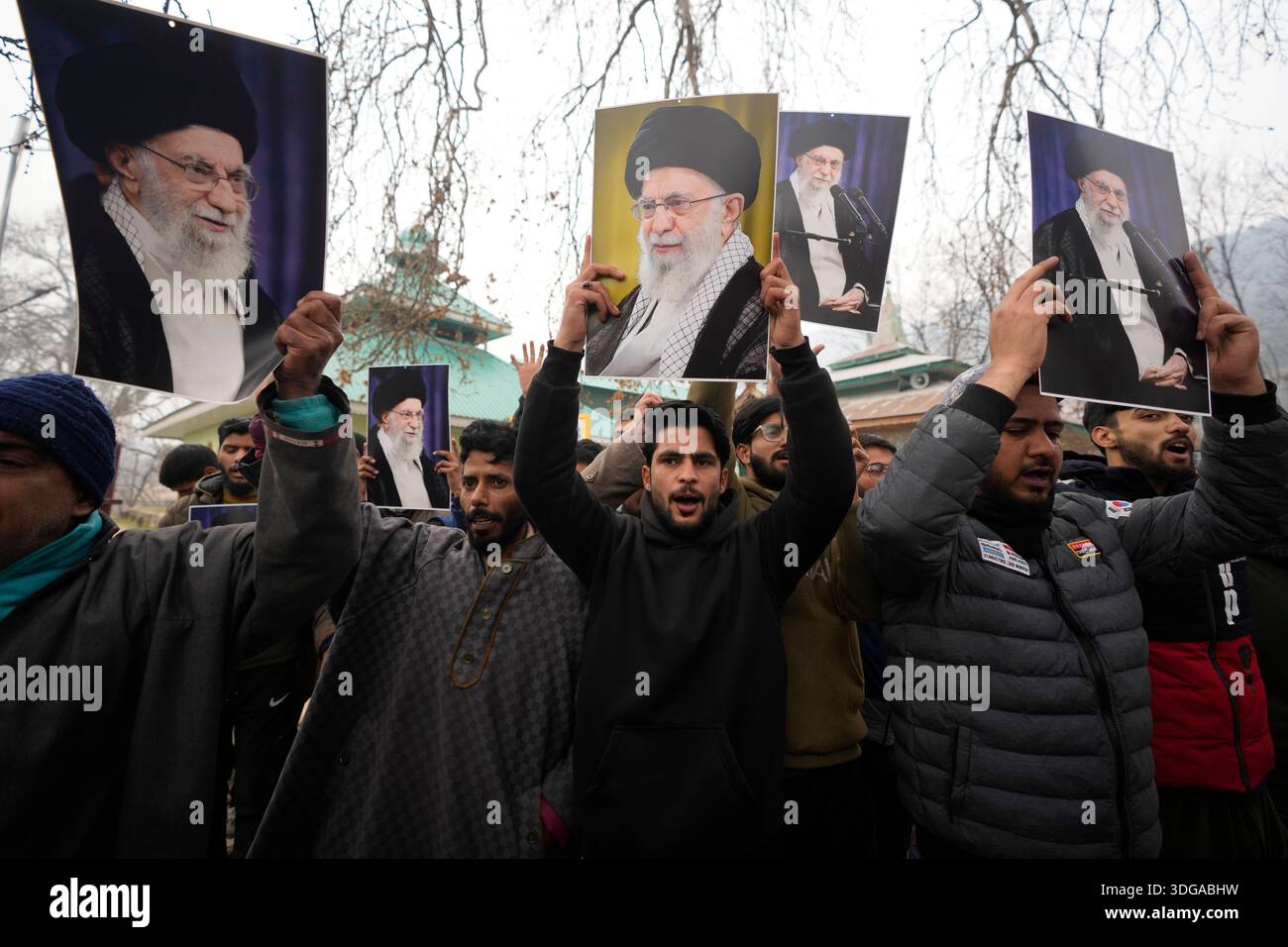 Kashmiri Shiite Muslim protesters chant slogans and hold photographs of ...