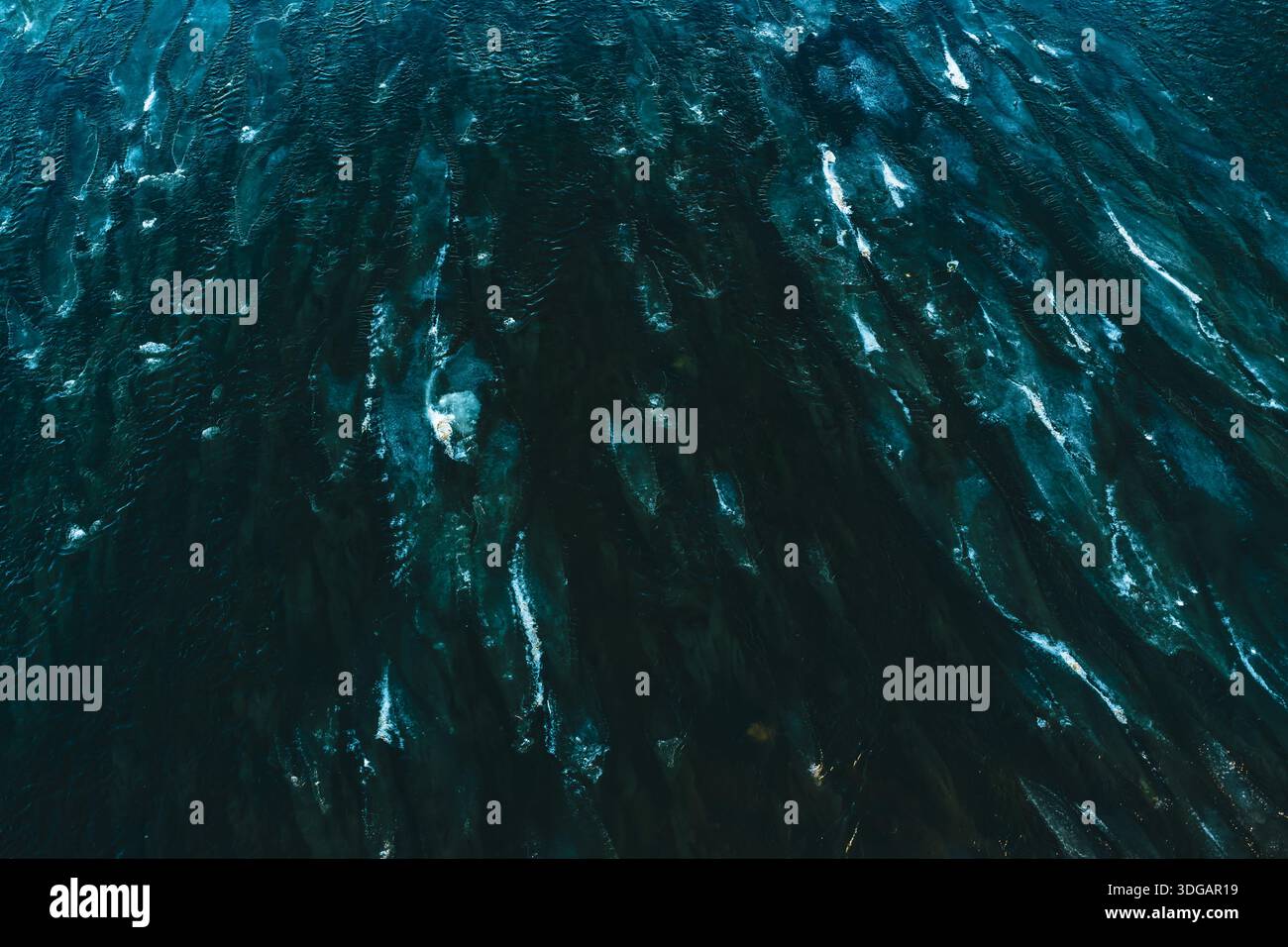 Dark Blue Water Surface with Dynamic Natural Ripple Patterns Stock Photo