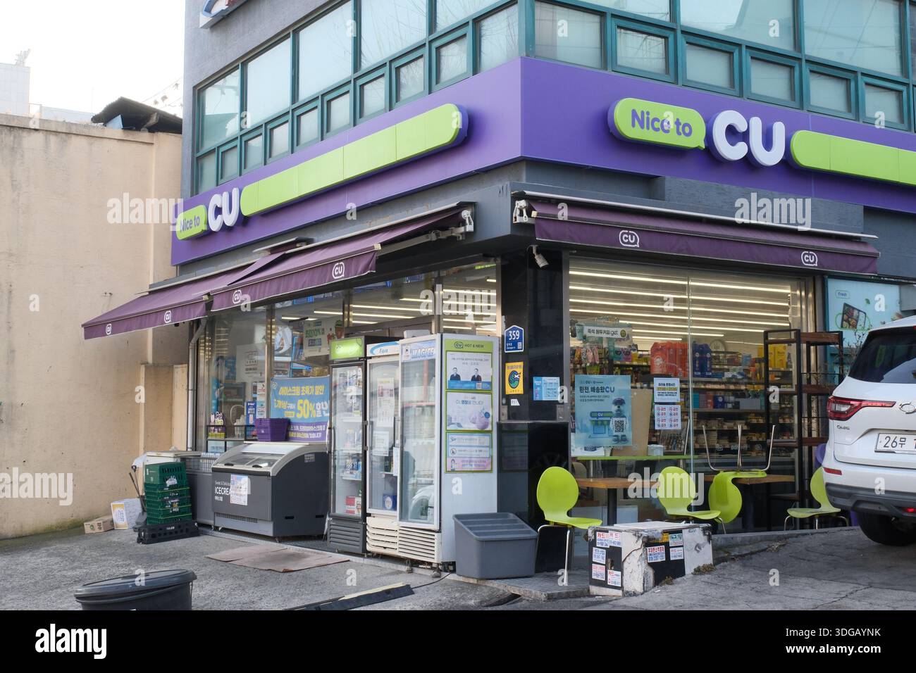 Seoul, South Korea: CU convenience store exterior with purple branding ...