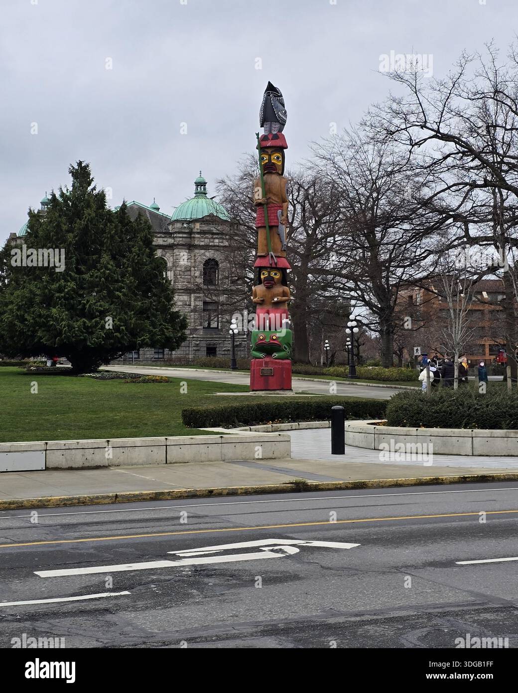 Traditional Indigenous totem pole in a public park in Victoria on Vancouver Island, British Columbia, Canada - Smartphone Captured Stock Image