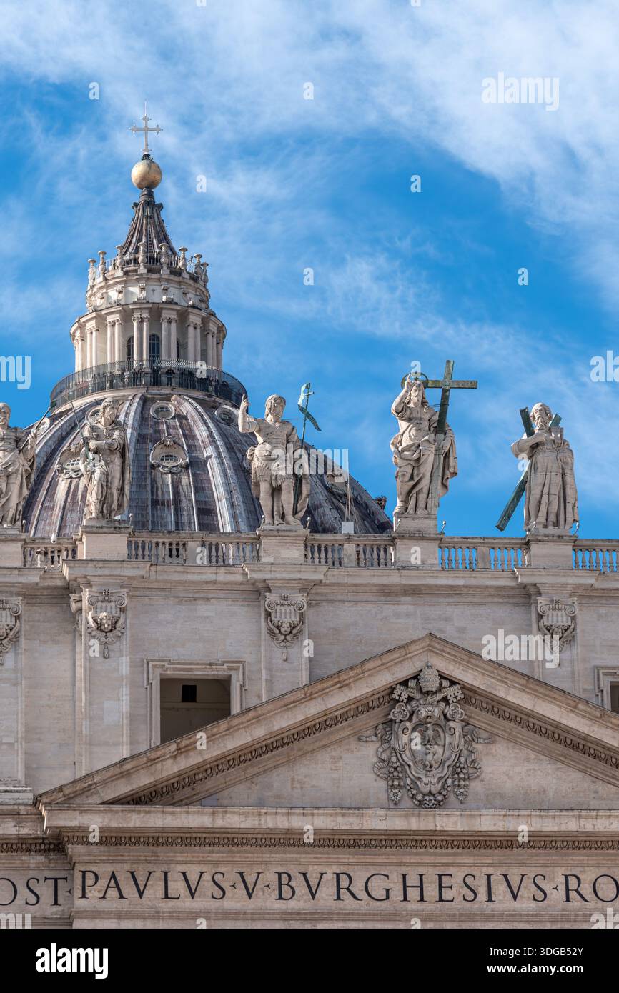 Statues of Jesus Christ and his apostles atop the façade of St. Peter's Basilica in the Vatican, the most important religious building in catholicism Stock Photo