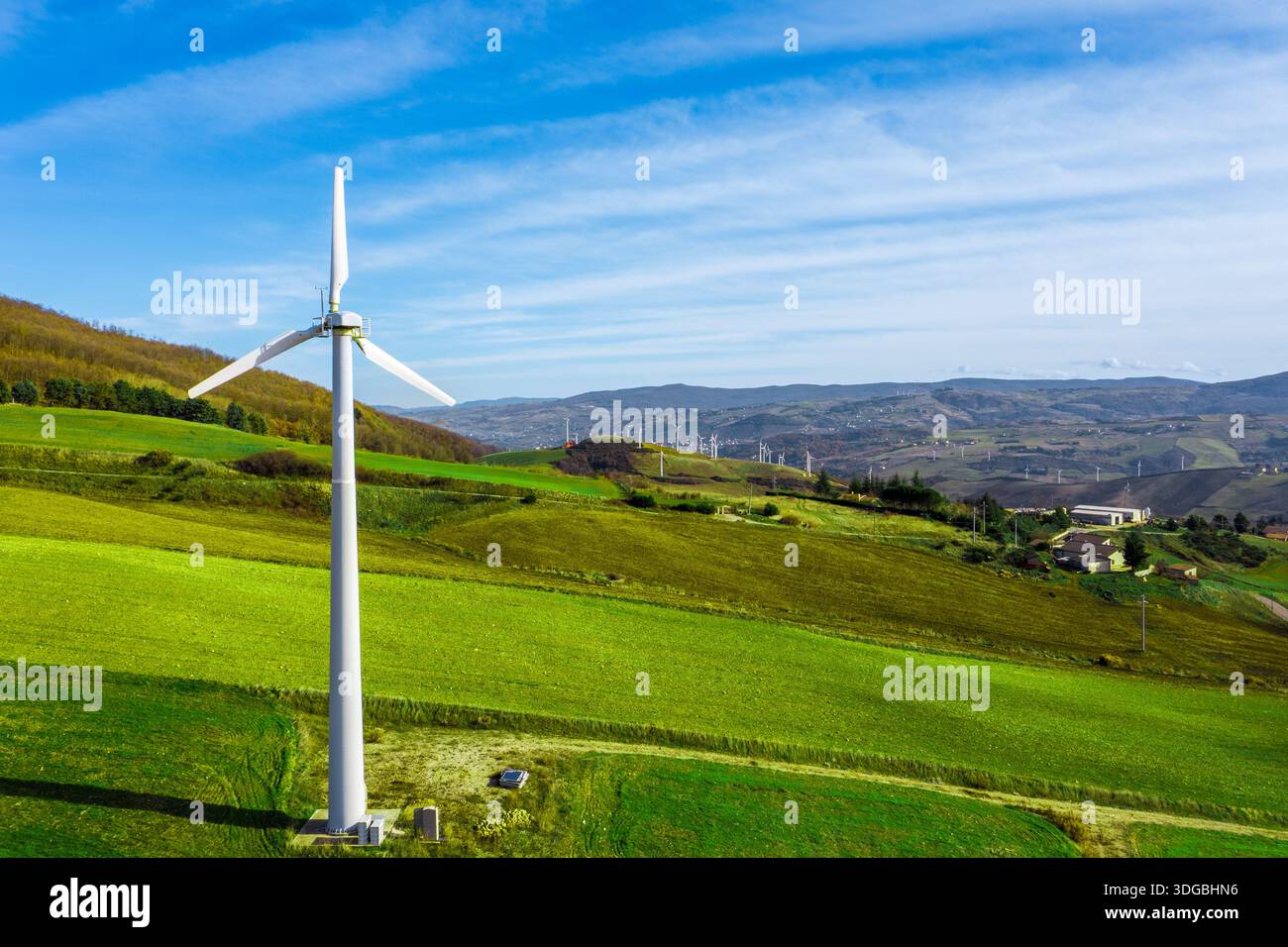 Aerial view of wind turbines harnessing clean power on verdant hills, a ...