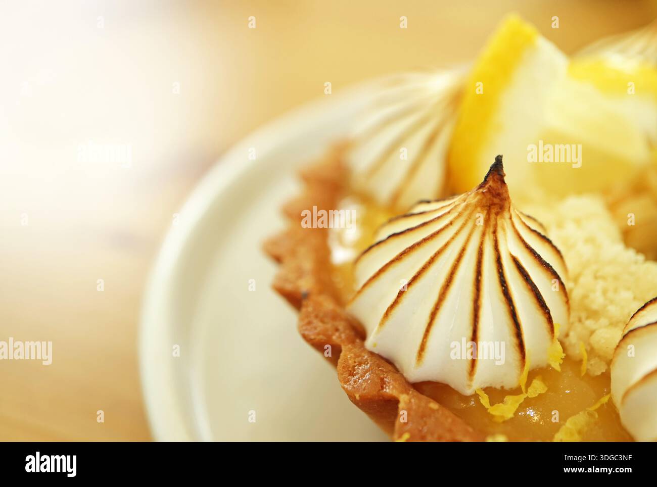 Swirl and Zest, Torch-Kissed Meringue on Silky Lemon Bliss Stock Photo