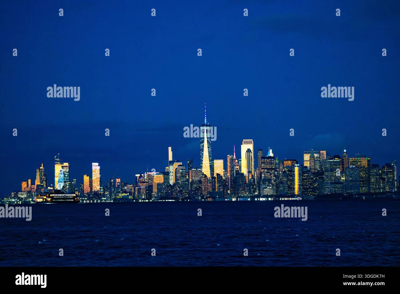 New York City skyline at night with illuminated skyscrapers and One ...