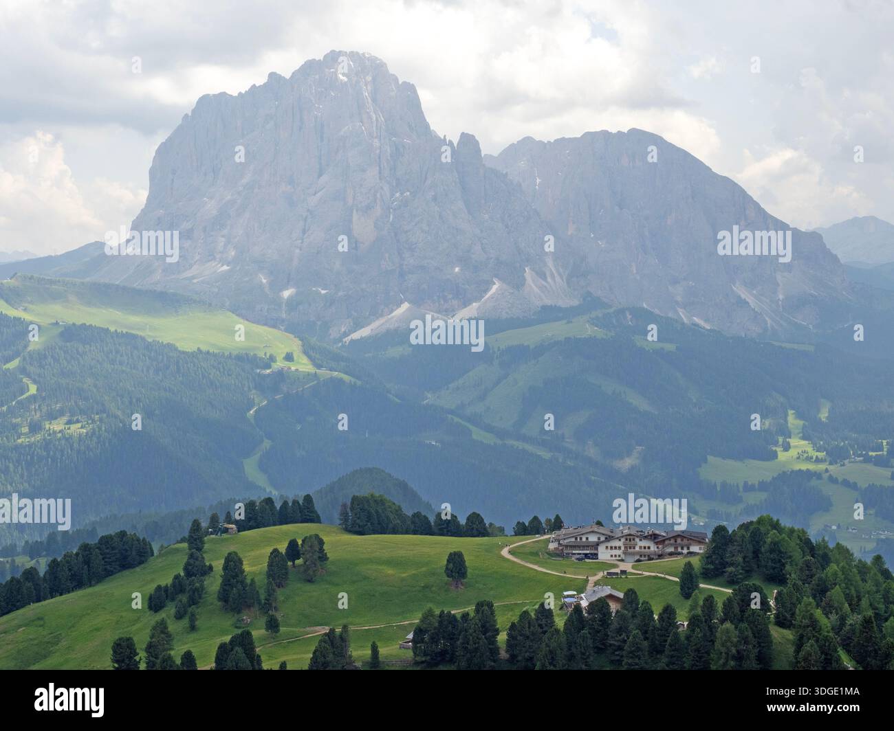 Sassolungo mountain towering above Col Raiser Stock Photo