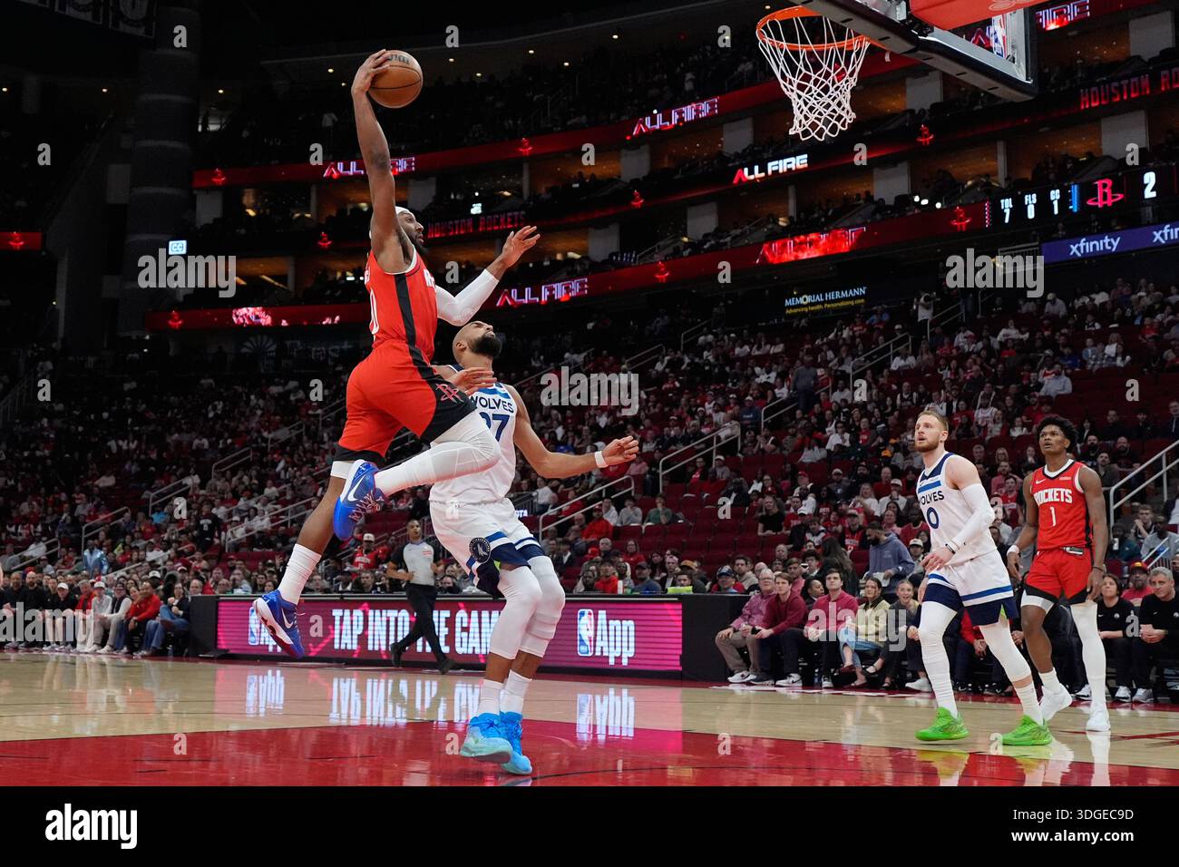 Houston Rockets guard Josh Okogie (20) dunks over Minnesota ...