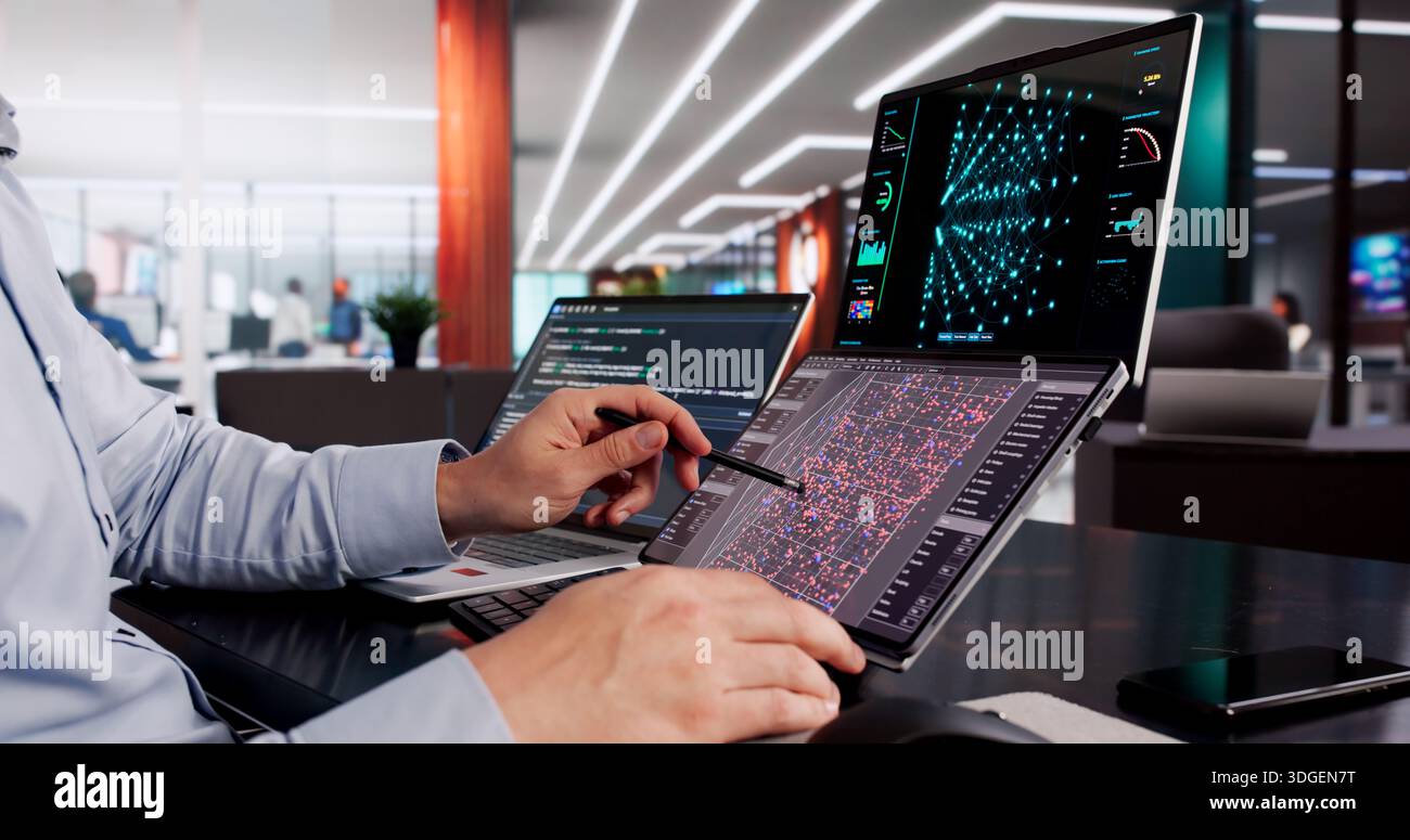 Hispanic Engineer Leads Meeting On AI Development At Computer Center Stock Photo