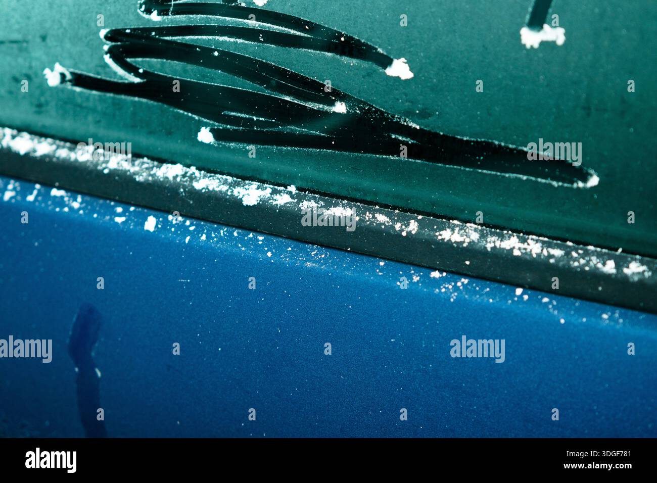 Frozen car window showing melting ice and seasonal change Stock Photo