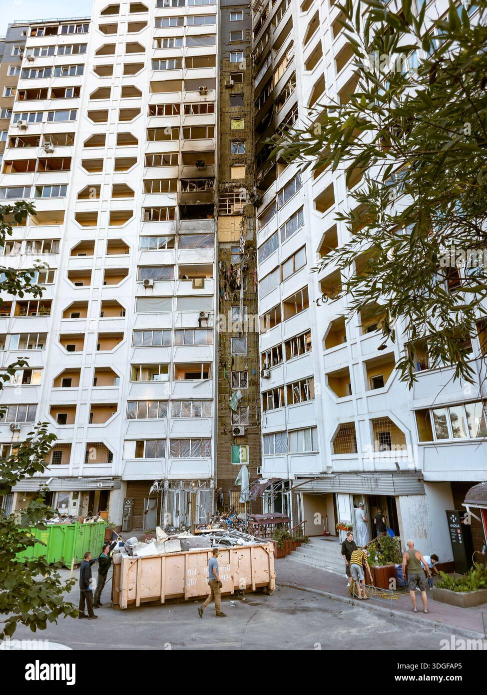 Kyiv, Ukraine - Aug 29, 2025: Residents independently clear their destroyed apartments. A day before a Russian attack drone by hit a facade. Debris is - Smartphone Captured Stock Image