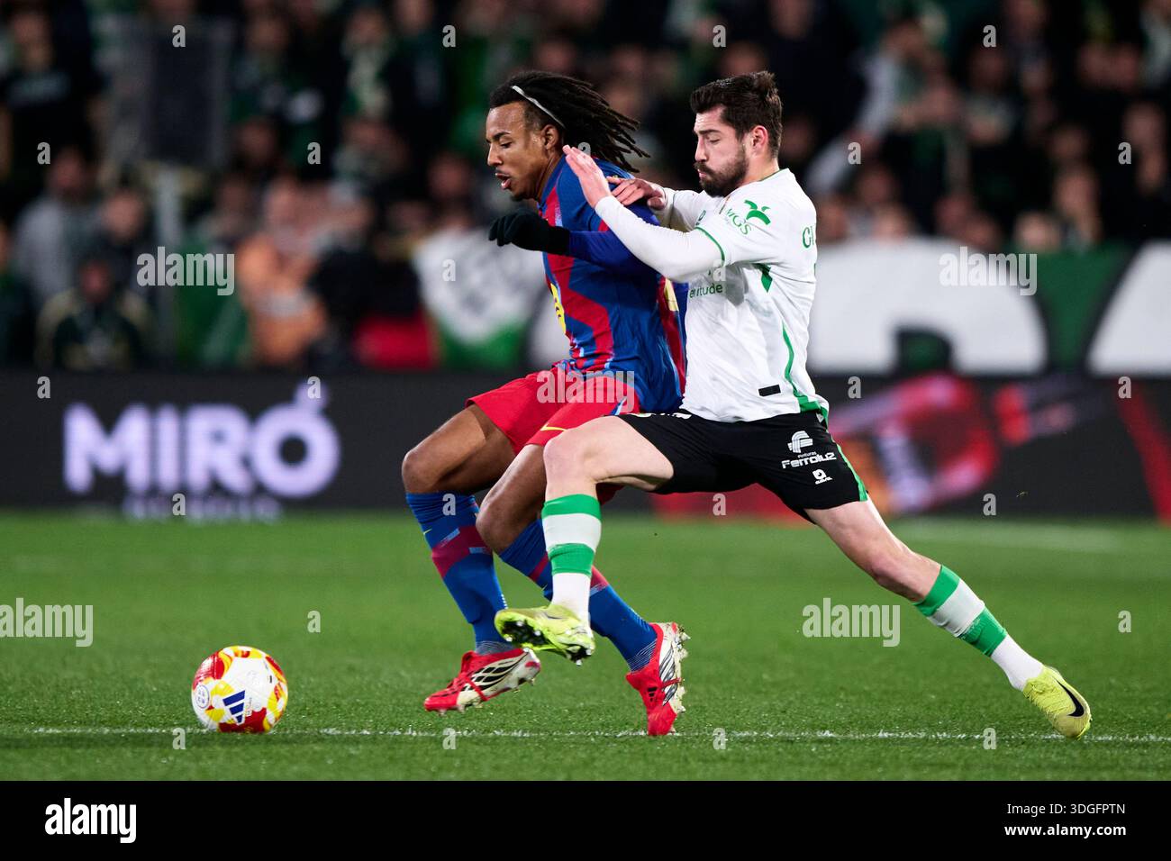 Jules Kounde of FC Barcelona duels for the ball with Giorgi Guliashvili of Real Racing Club during the Copa del Rey Round of 16 match between Real Rac Stock Photo