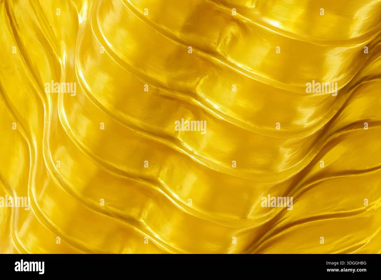 wavy gold texture for background and design. Stock Photo