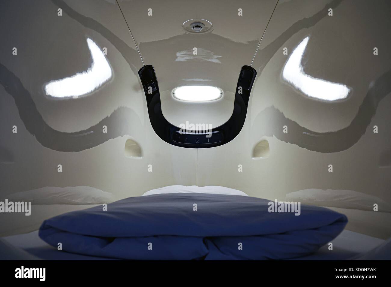 Interior of a capsule hotel sleeping capsule, futuristic design with ...