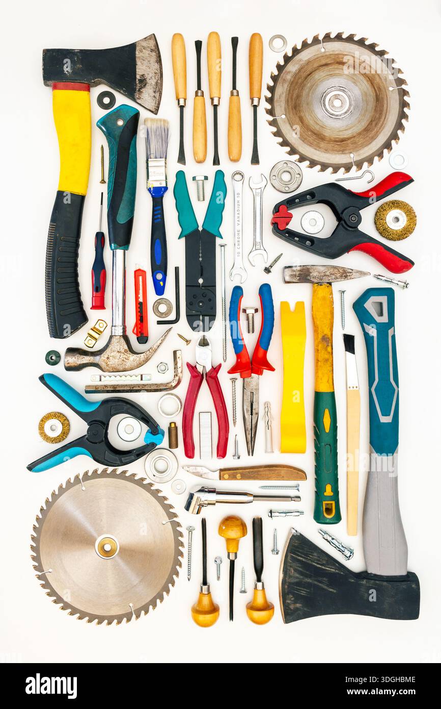 Flat lay of new and used hand tools on white background. Large collection of various tools and bits arranged on white. Stock Photo