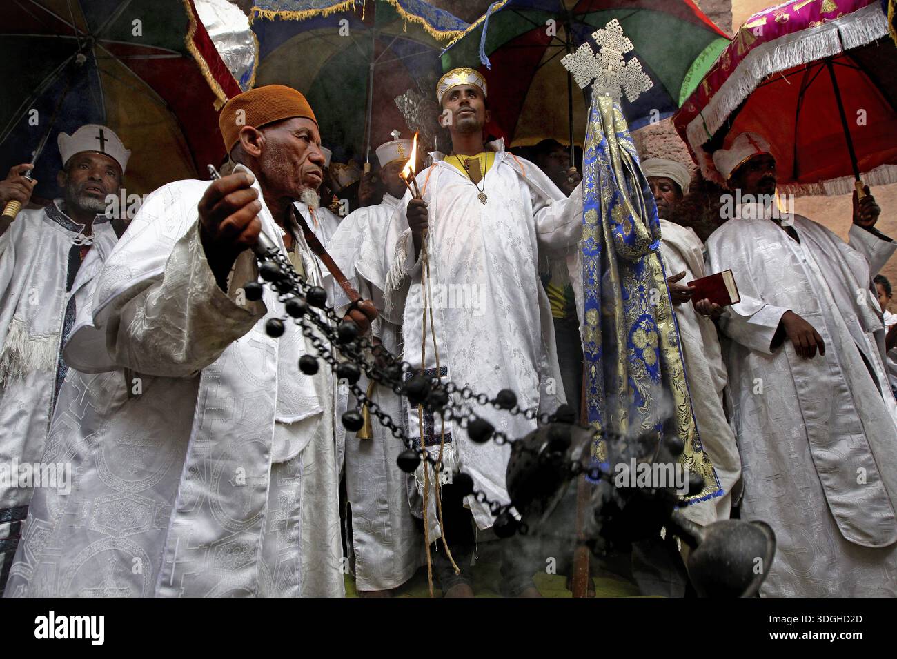 Religious procession with men wearing traditional clothing and crosses ...