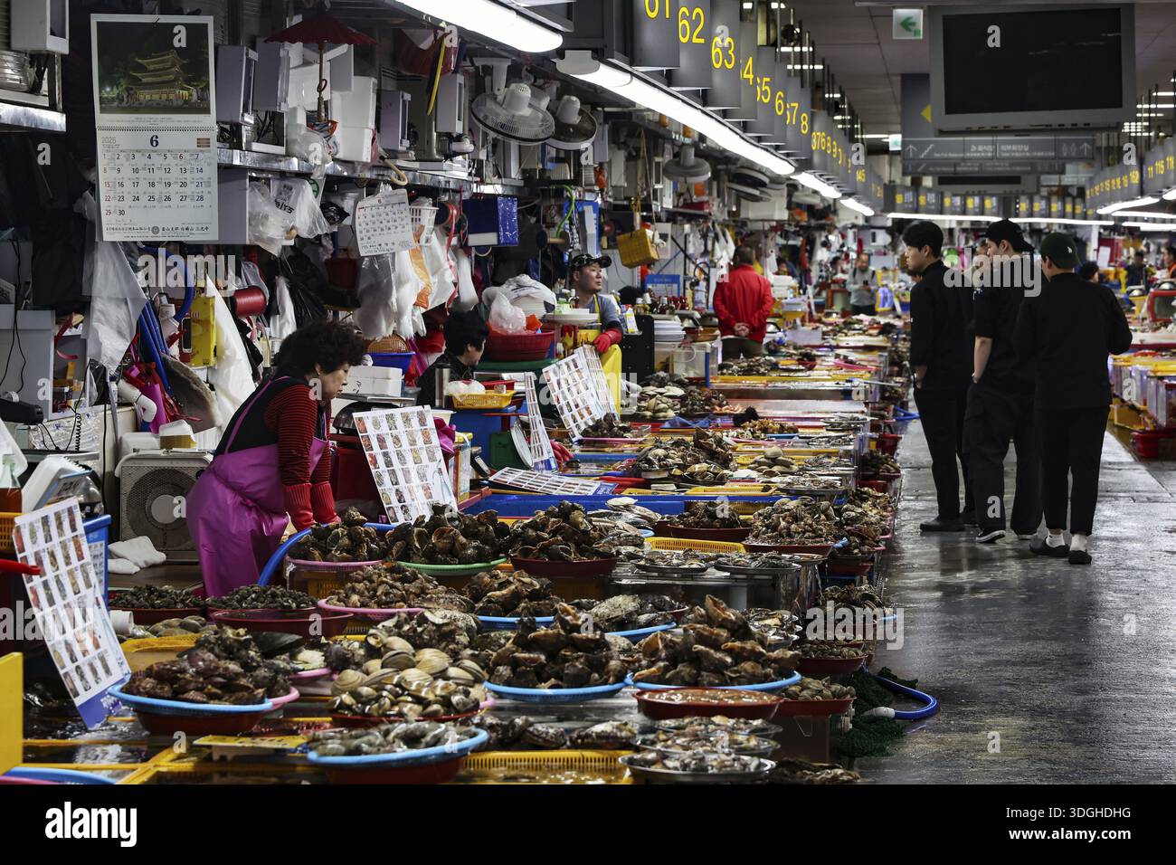 Bustling Jagalchi fish market in Busan full of people and stalls, Busan, South Korea Stock Photo