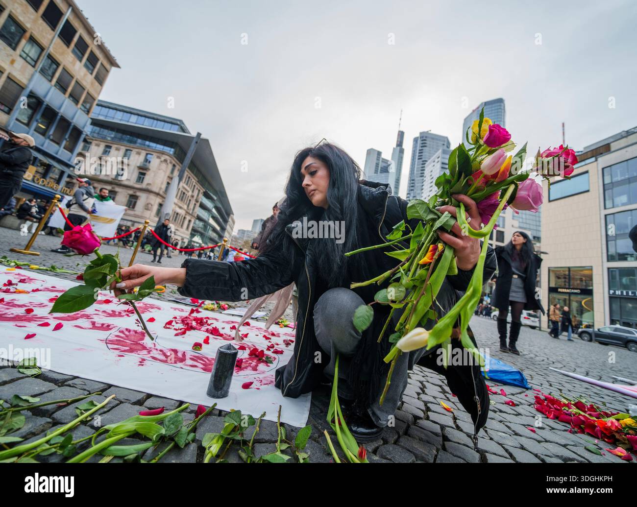 Protest Installations A woman places flowers on an installation during a demonstration in ...