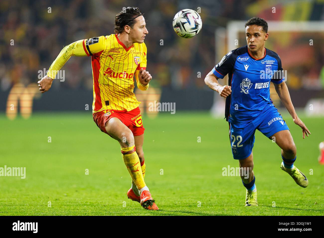 Lens' Florian Thauvin, left, challenges for the ball with Auxerre's Fredrik Oppegard during the French League One soccer match between Lens and Auxerre in Lens, France, Saturday, Jan. 17, 2026. (AP Photo/Jean-Francois Lens' Florian Thauvin, left, challenges for the ball with Auxerre's Fredrik Oppegard during the French League One soccer match between Lens and Auxerre in Lens, France, Saturday, Jan. 17, 2026. (AP Photo/Jean-Francois