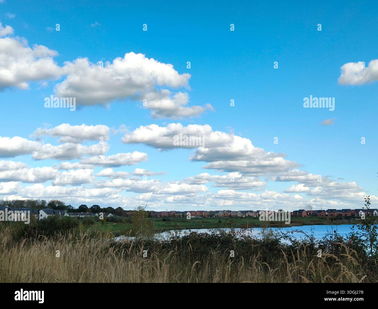 Dramatic cartoon like clouds over Beeby's Lake, Peterborough, UK - Smartphone Captured Stock Image