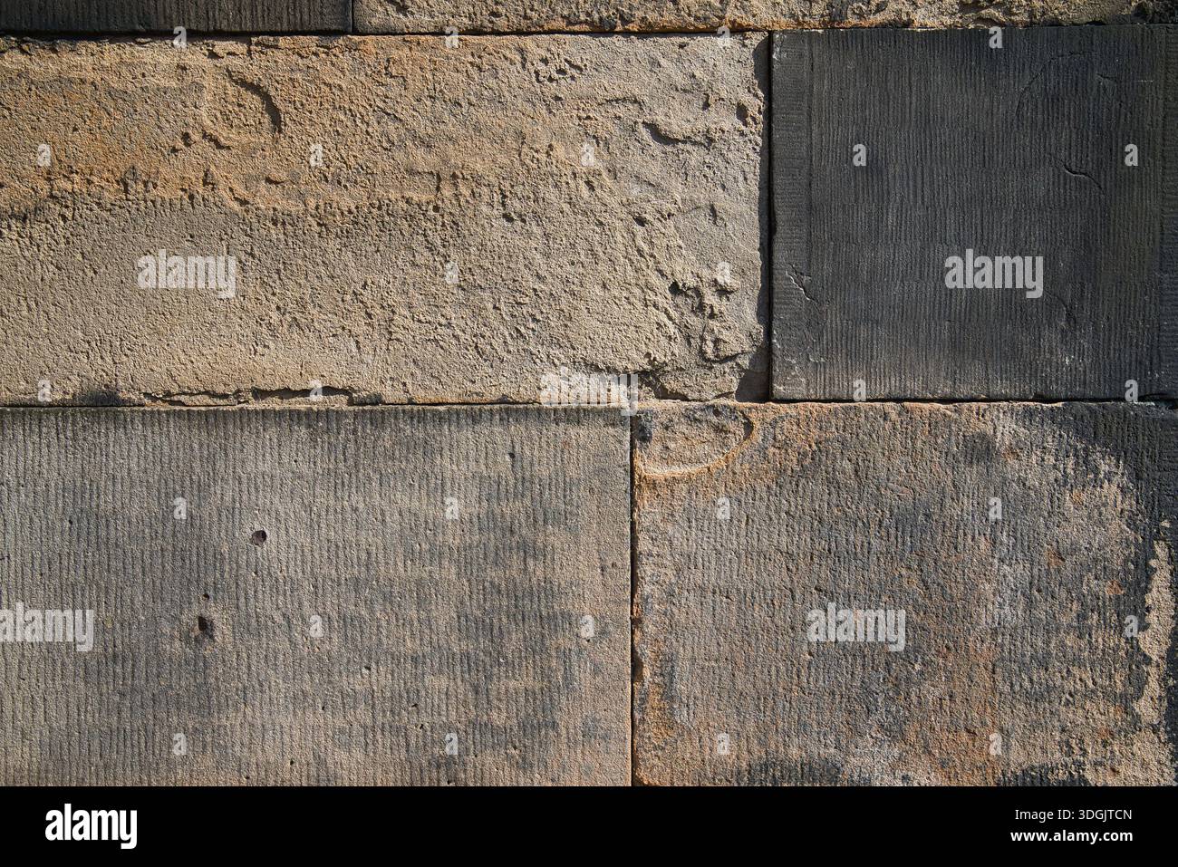 Detailed view of large, clean-cut stone blocks in contrasting neutral ...