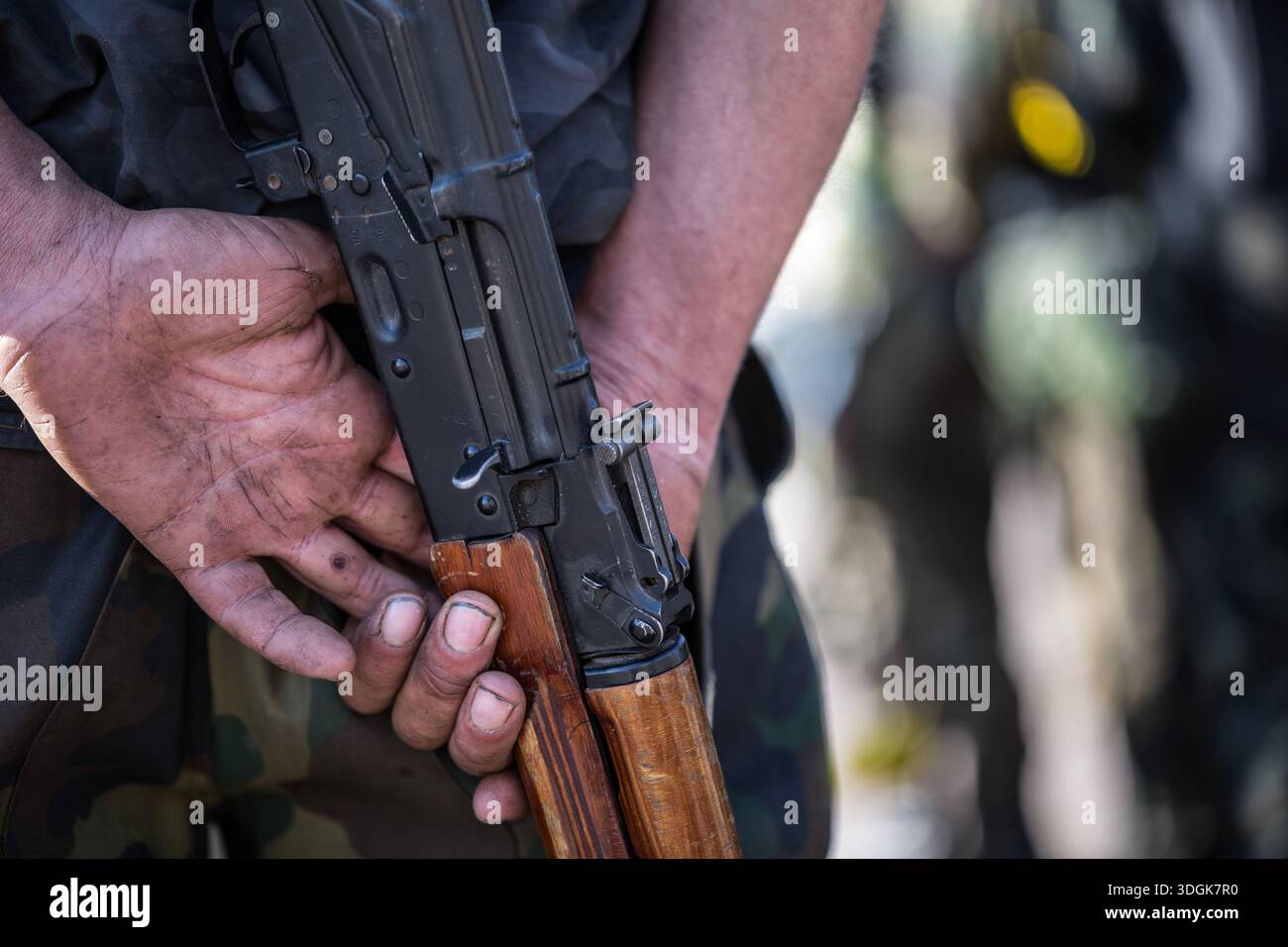 Man holding ak47 gun hi-res stock photography and images - Alamy