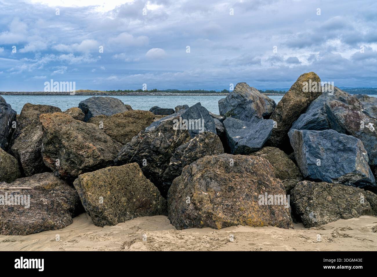 Rocks and boulders form a section of the south jetty at the inlet to ...