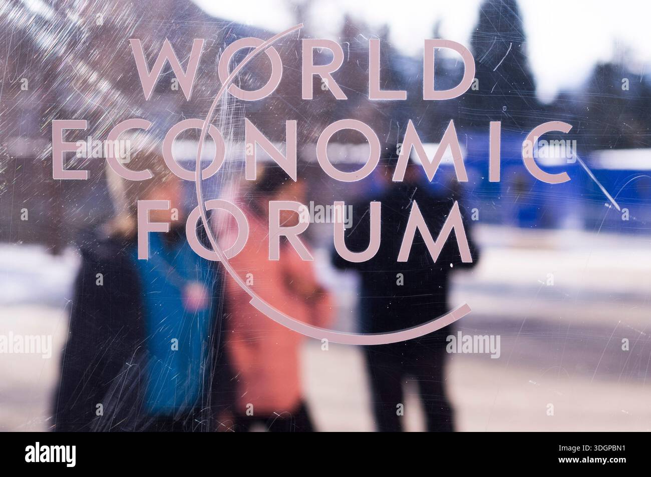 The logo of the World Economy Forum is displayed on a window of the ...