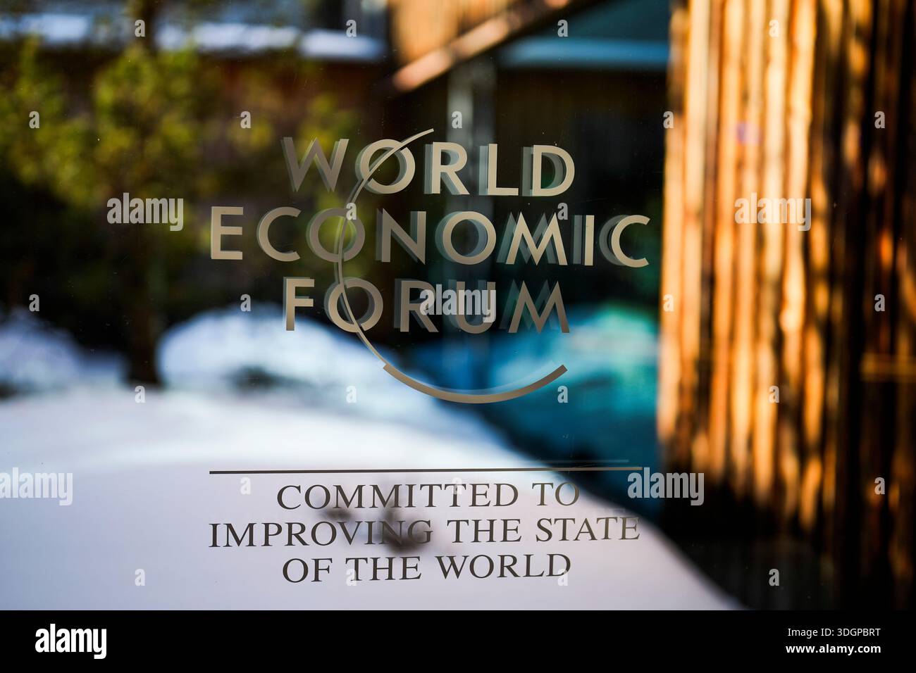 The logo of the World Economy Forum is displayed on a window of the ...