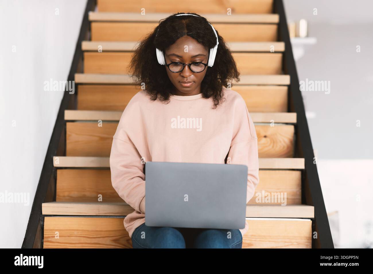 Black Young Female Freelancer Using Laptop Working Online At Home Stock Photo