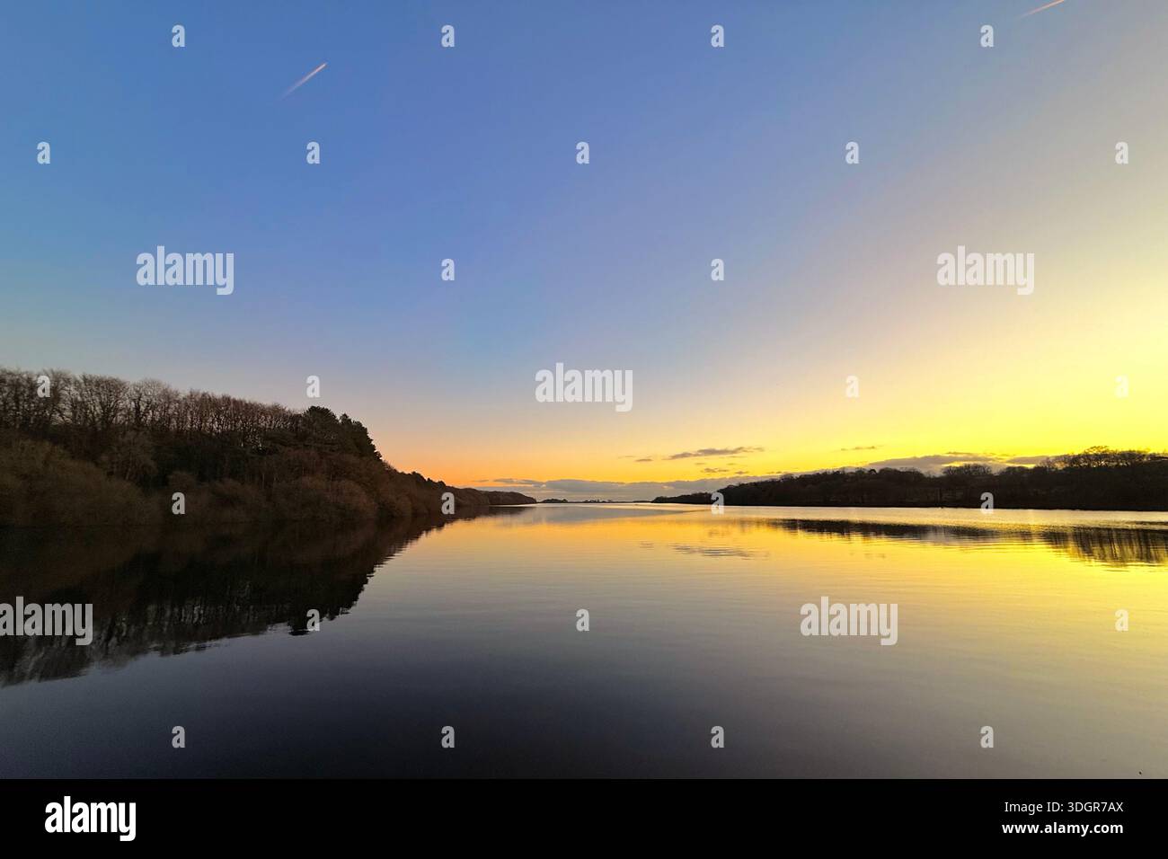 Rivington lower reservoir near Chorley in Lancashire. Dusk and reflections on the lower reservoir - Smartphone Captured Stock Image