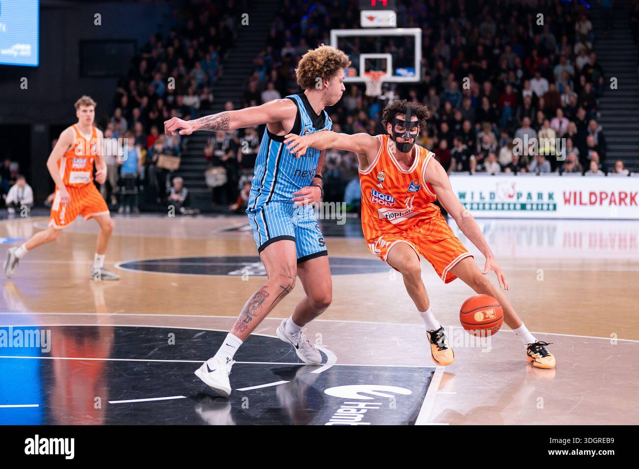 Alec Anigbata (Ratiopharm Ulm, #21) dribbling against Zacharie Perrin ...