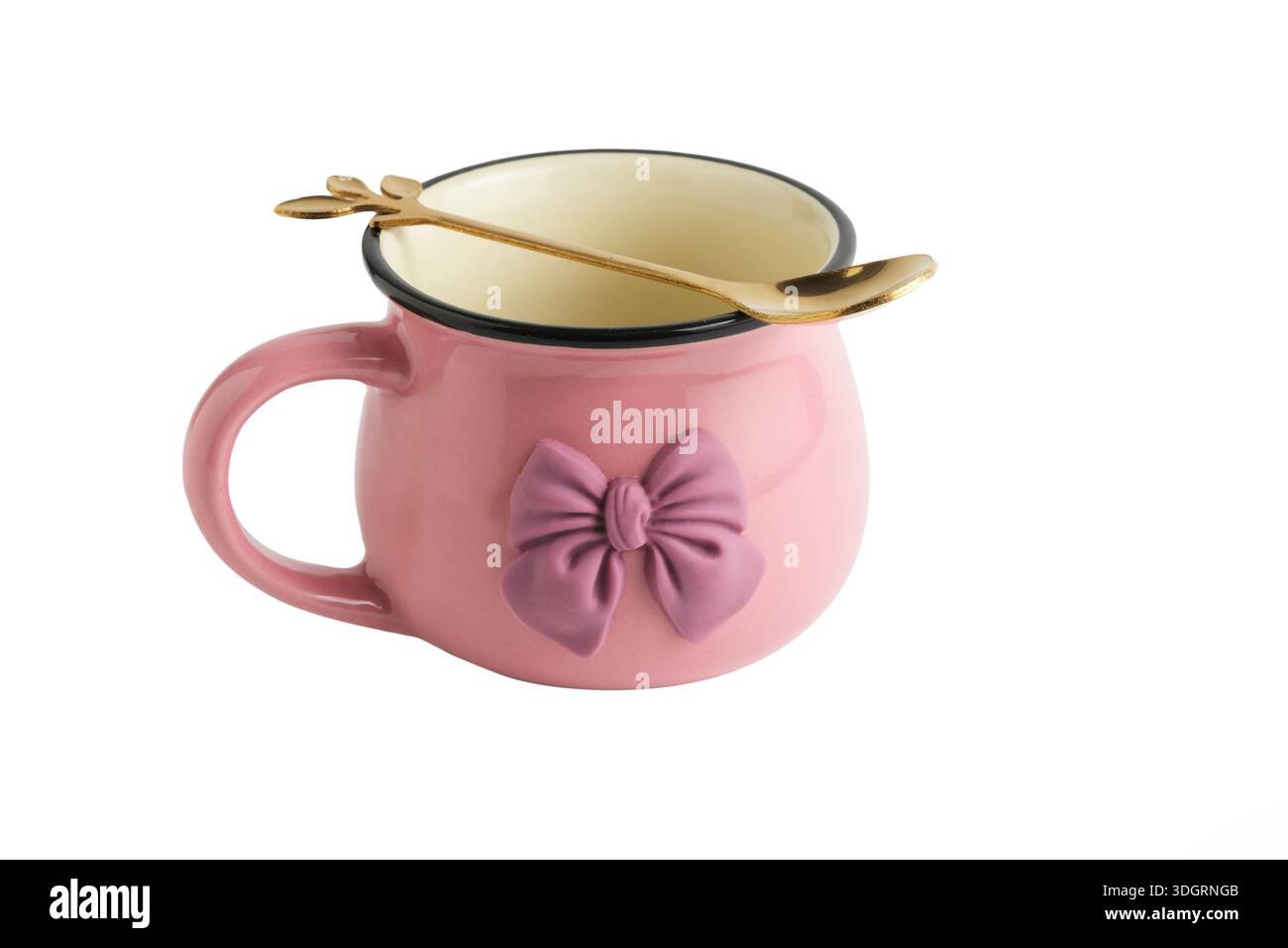 Pink mug with bow on white background, isolated object Stock Photo