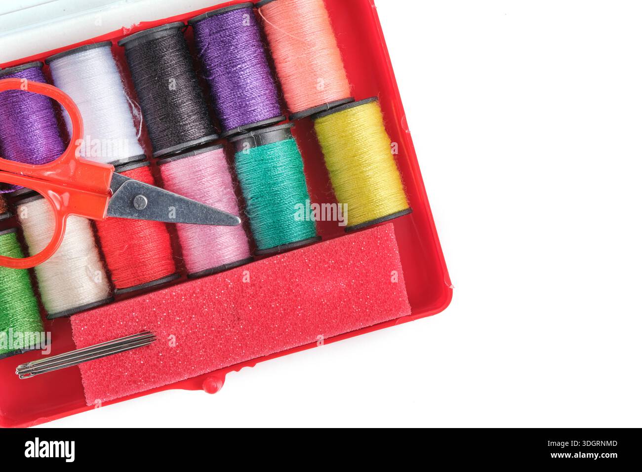 Sewing accessories in red box on white background Stock Photo