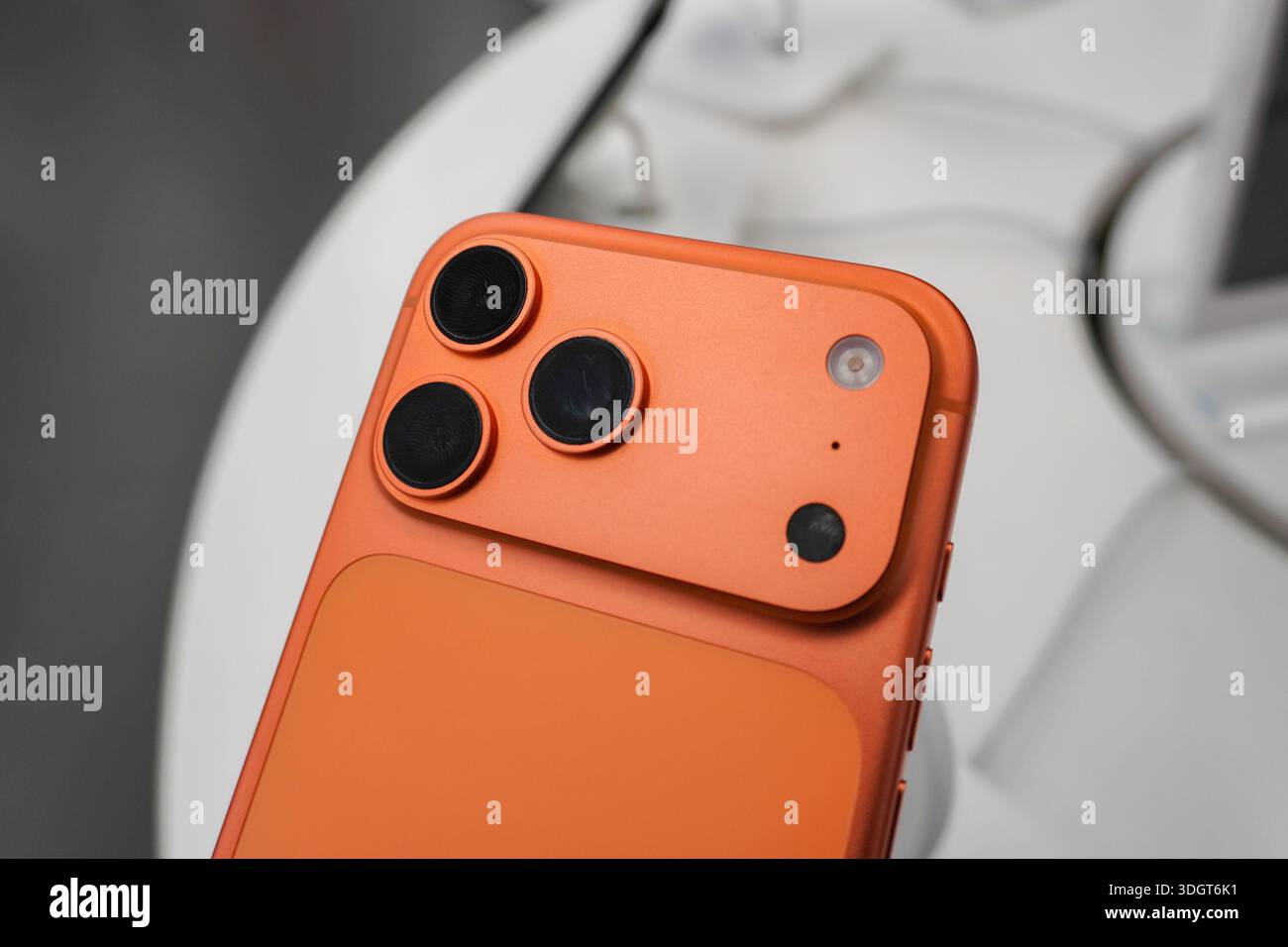 A close-up of the rear camera module of an iPhone 17 Pro highlighting ...