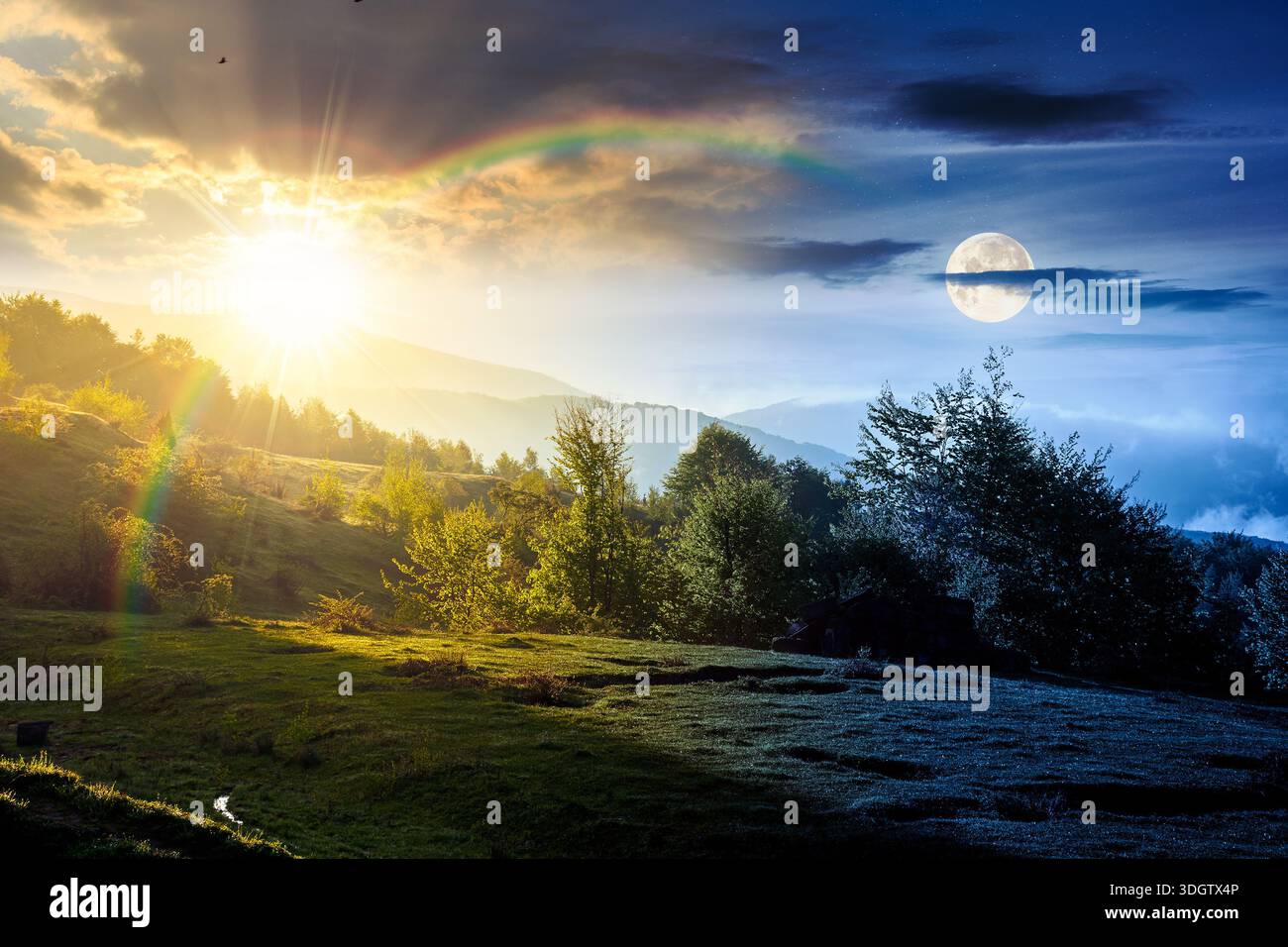 mountain landscape in fog. day and night time change concept. lush green alpine meadows in spring with sun and moon at twilight. beautiful view in to Stock Photo