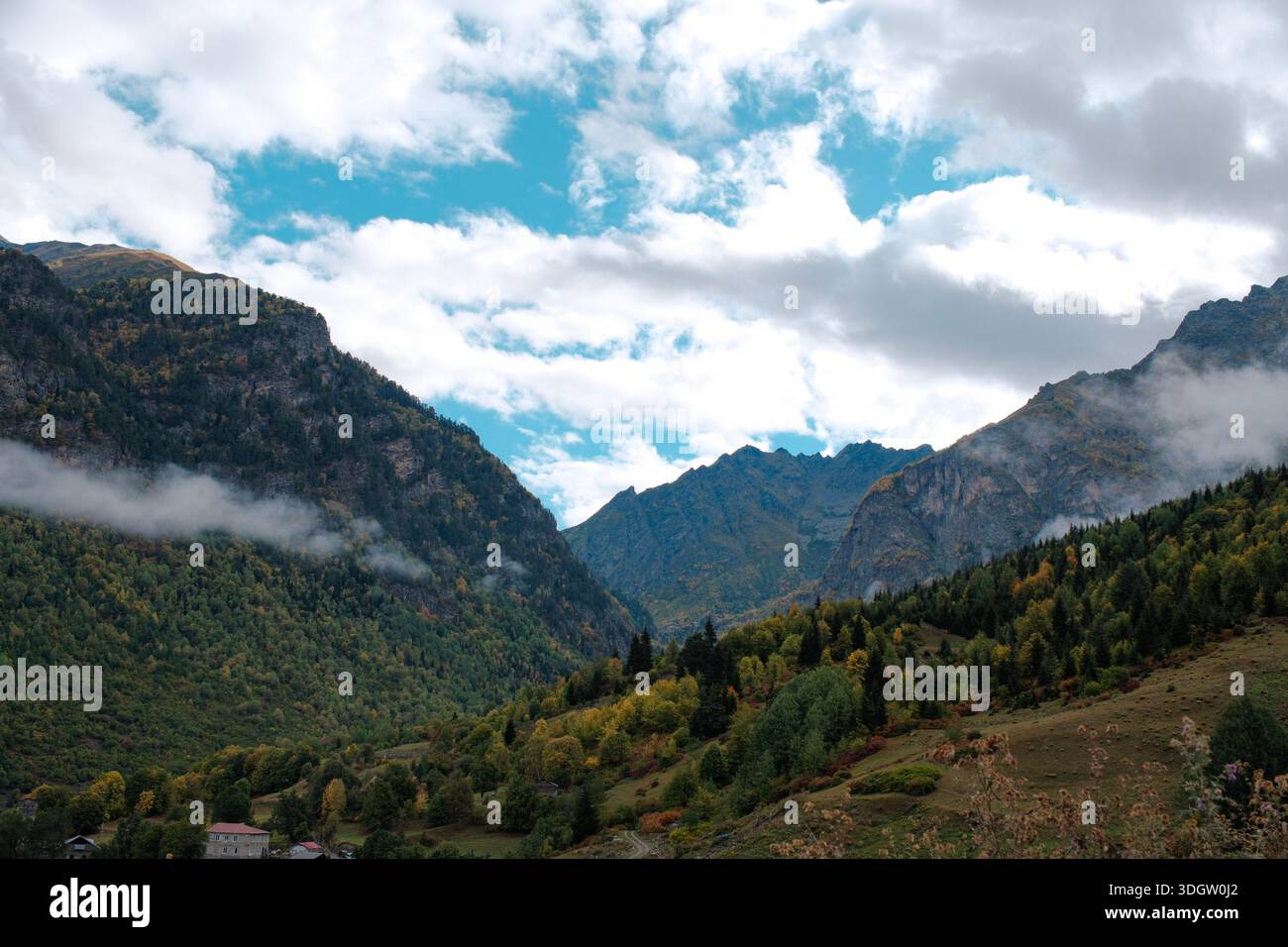 Open mountain landscape with wide grassy hills, dry steppe in