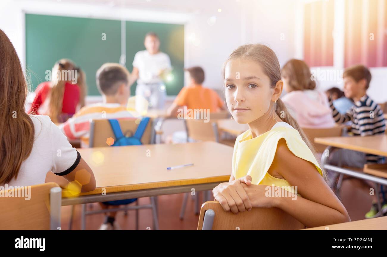 Preteen girl sitting school hi-res stock photography and images - Alamy