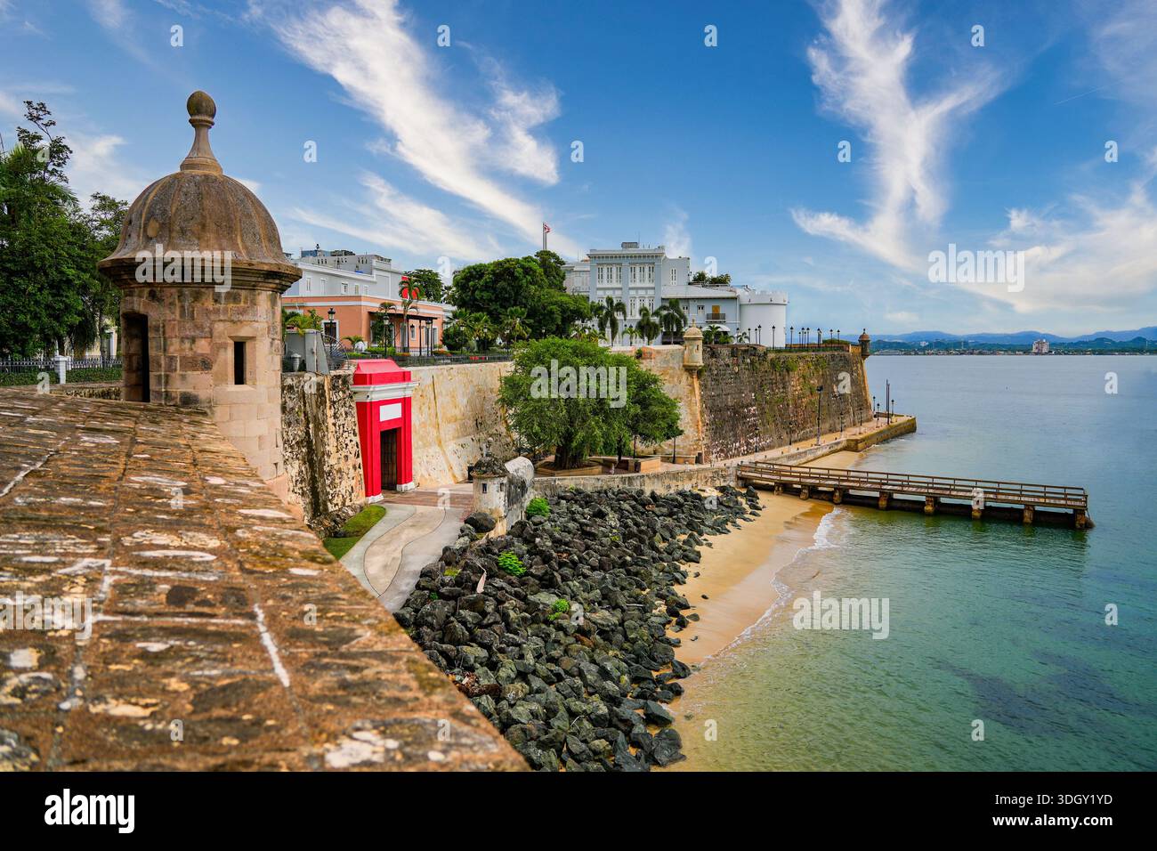 Historic city walls and red Puerta de San Juan, the capital city of ...