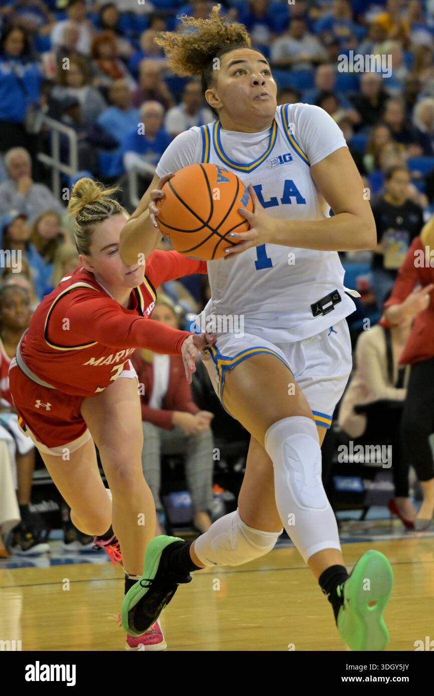 UCLA guard Kiki Rice (1) drives past Maryland guard Addi Mack during ...