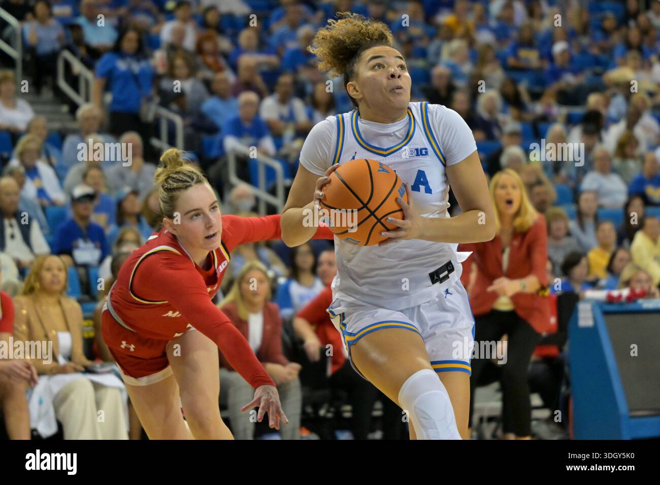 UCLA guard Kiki Rice (1) drives past Maryland guard Addi Mack during ...