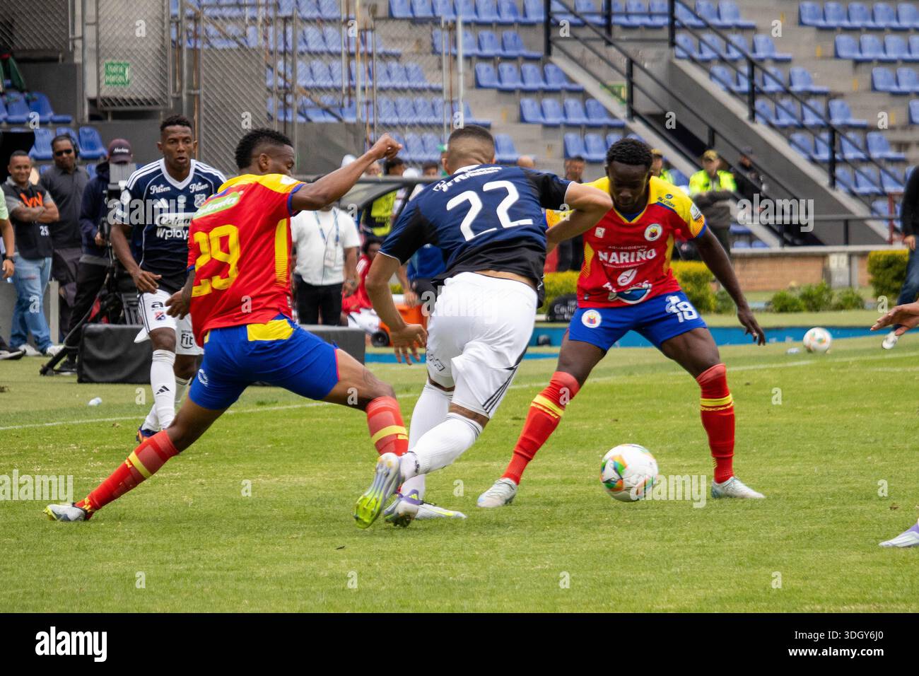 Pasto, Colombia. 18th Jan, 2026. Deportivo Pasto's Santiago Cordoba (L) and Joider Micolta (R) fight the ball with Independiente Medellin's Daniel Londono (C) during the BetPlay Dimayor League match between Deportivo Pasto ( Pasto, Colombia. 18th Jan, 2026. Deportivo Pasto's Santiago Cordoba (L) and Joider Micolta (R) fight the ball with Independiente Medellin's Daniel Londono (C) during the BetPlay Dimayor League match between Deportivo Pasto (