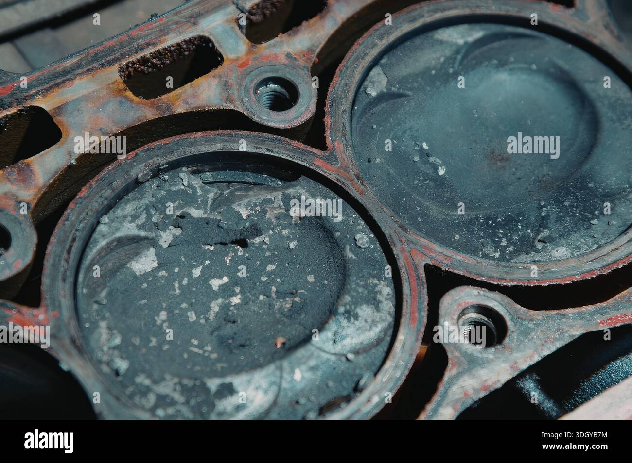 A detailed close-up of rusty engine parts, showcasing the worn and ...
