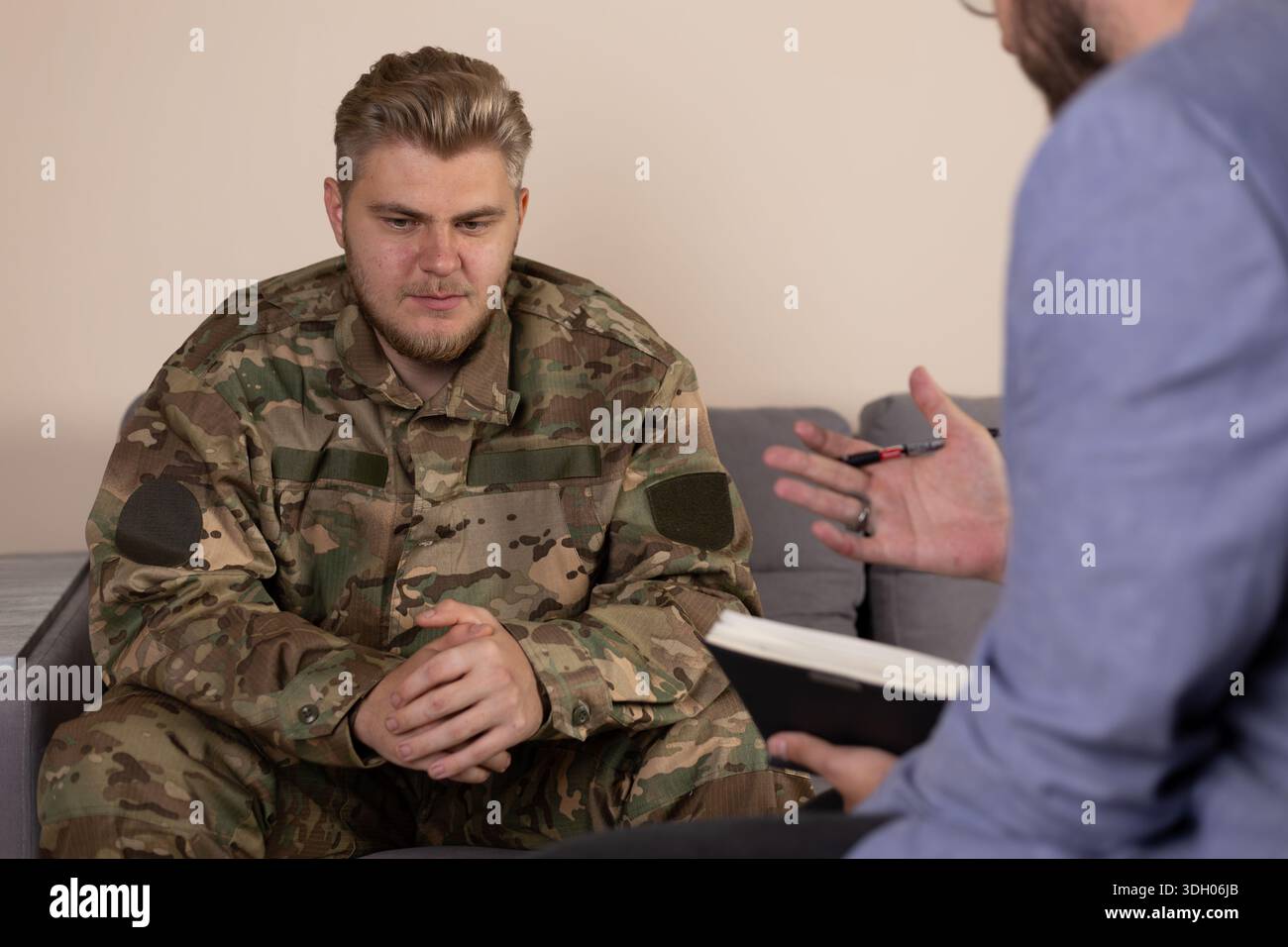 Two men sitting on sofa hi-res stock photography and images - Alamy
