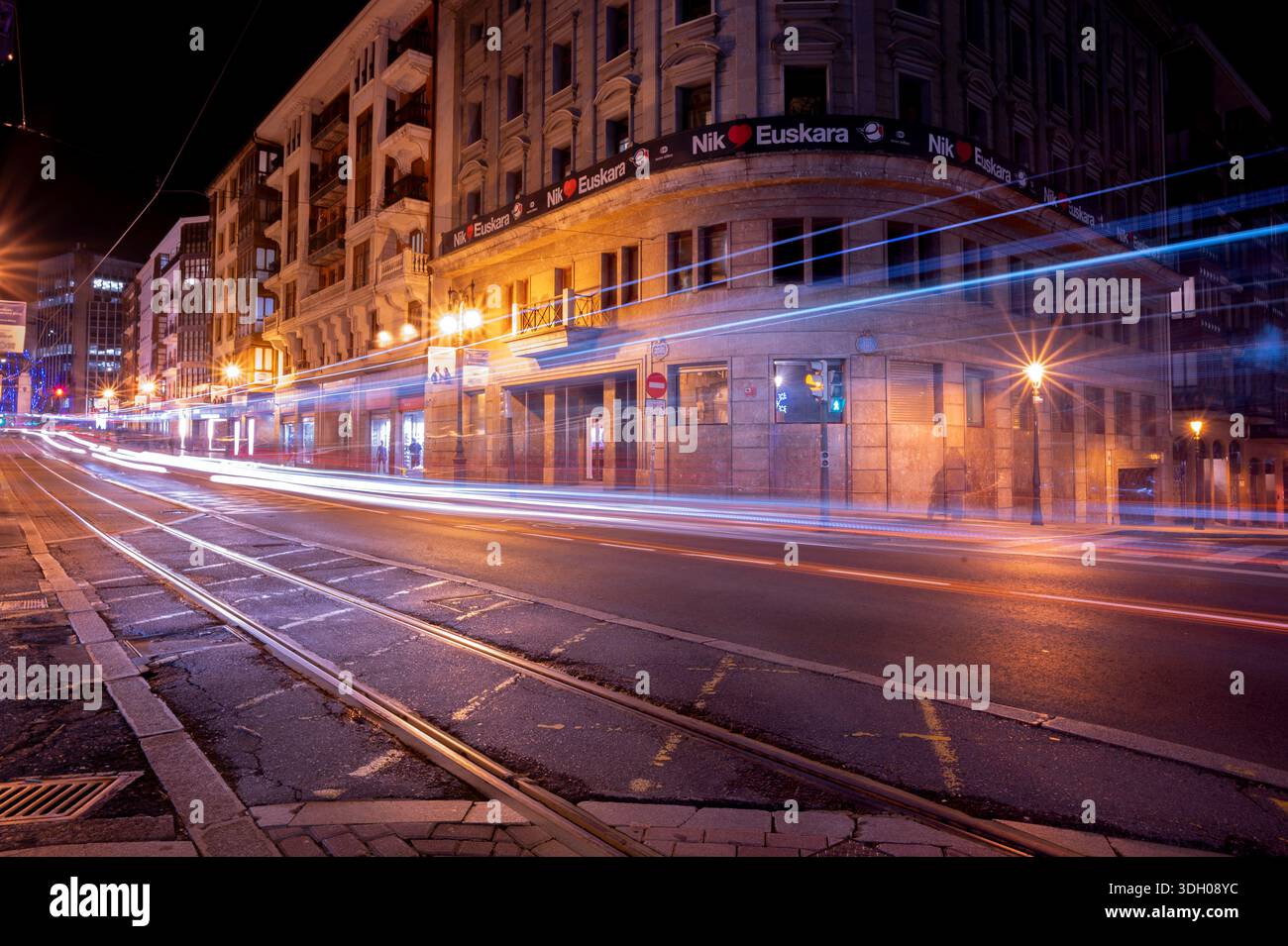 light trails from passing cars and Basque language banners. Stock Photo