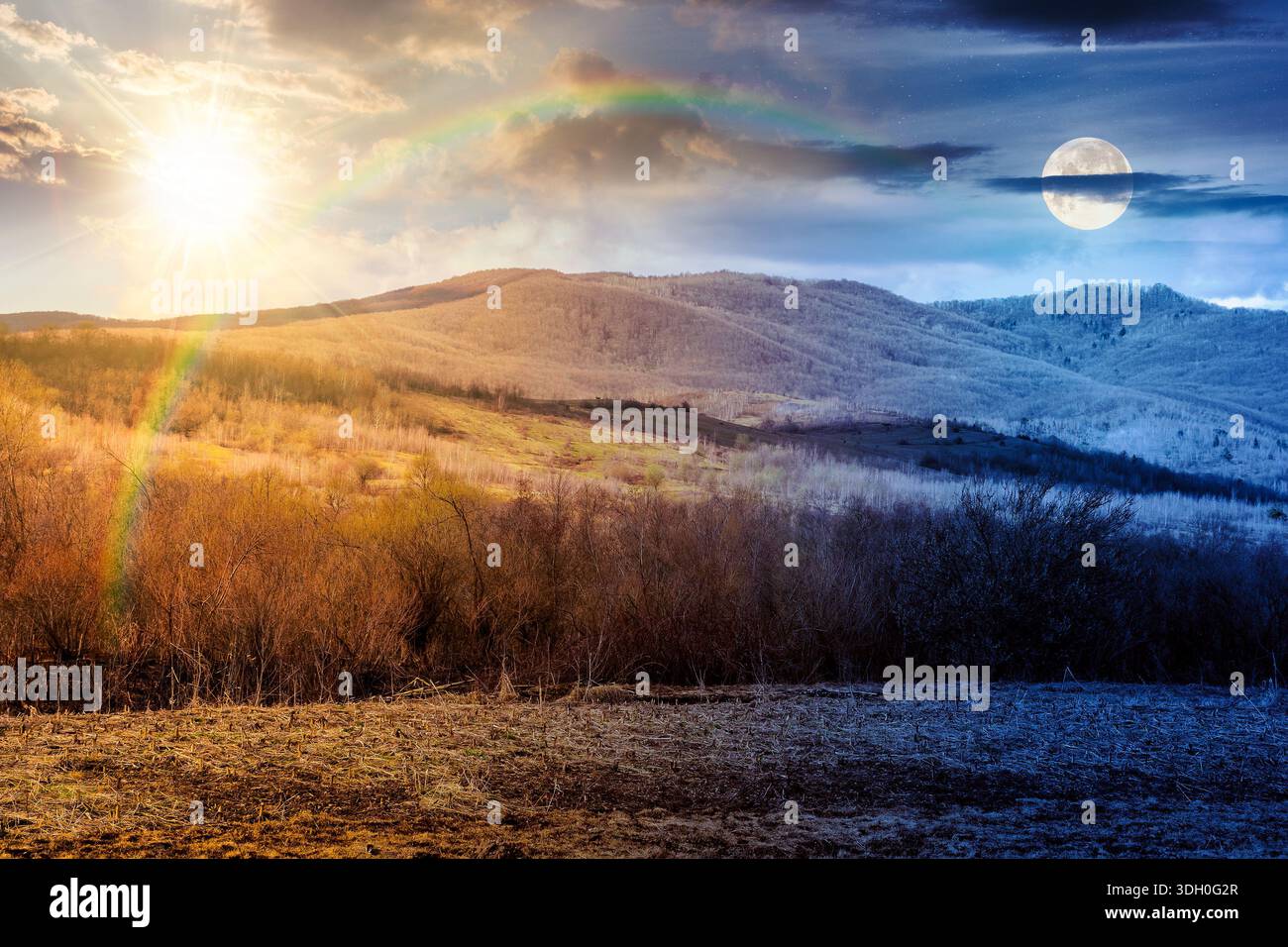 early spring rural landscape in mountains. day and night time change concept. beautiful view of countryside scenery with field in march with sun and m Stock Photo