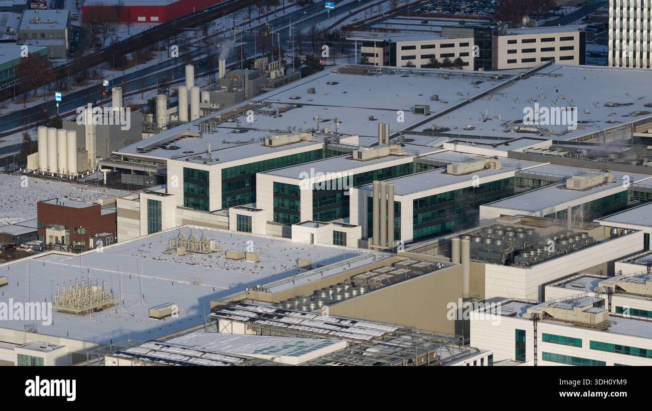 Aerial view of the sprawling ASML complex dusted with snow, its modern ...